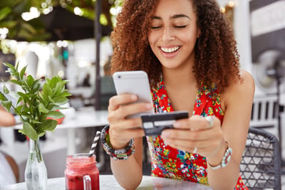 A young lady with Middlesex Federal Debit Card